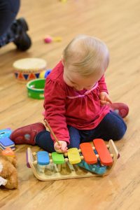 Image shows toddler enjoying Music Bugs class