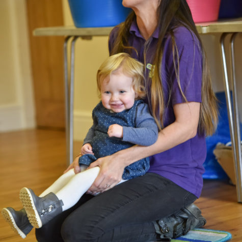 Image shows toddler enjoying in Music Bugs class with Class Leader